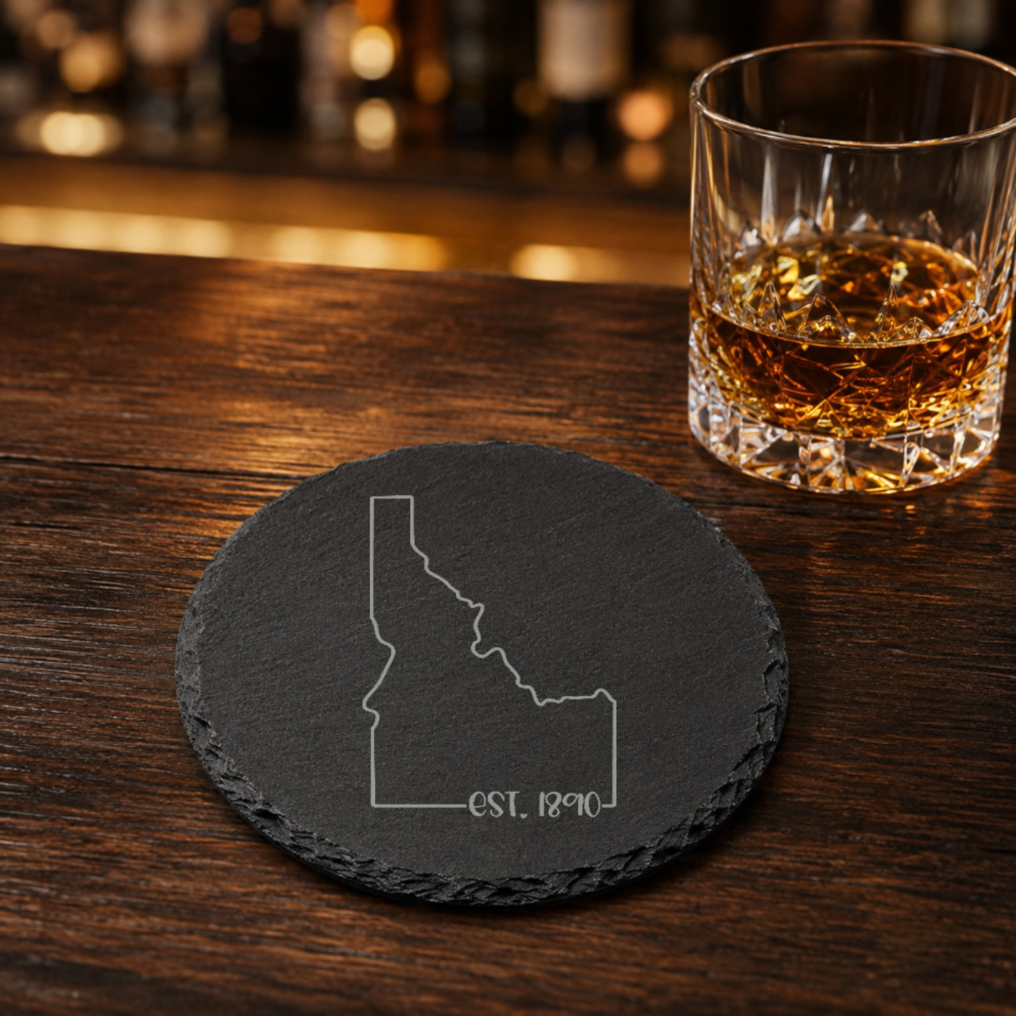 Idaho Slate Coasters 4x4 Laser Engraved Stone Drink Coasters Idaho Home Decor Gem State Established 1890 Gift — Dandelion Design Co. — SlateStudioMedia:gallery:23 — 0070-ISGN_idaho_slate_coasters_4x4_laser_engraved_stone_drink_coasters_idaho_home_decor_gem_state_established_1890_gift_16_D02_round_whiskey_lifestyle.png