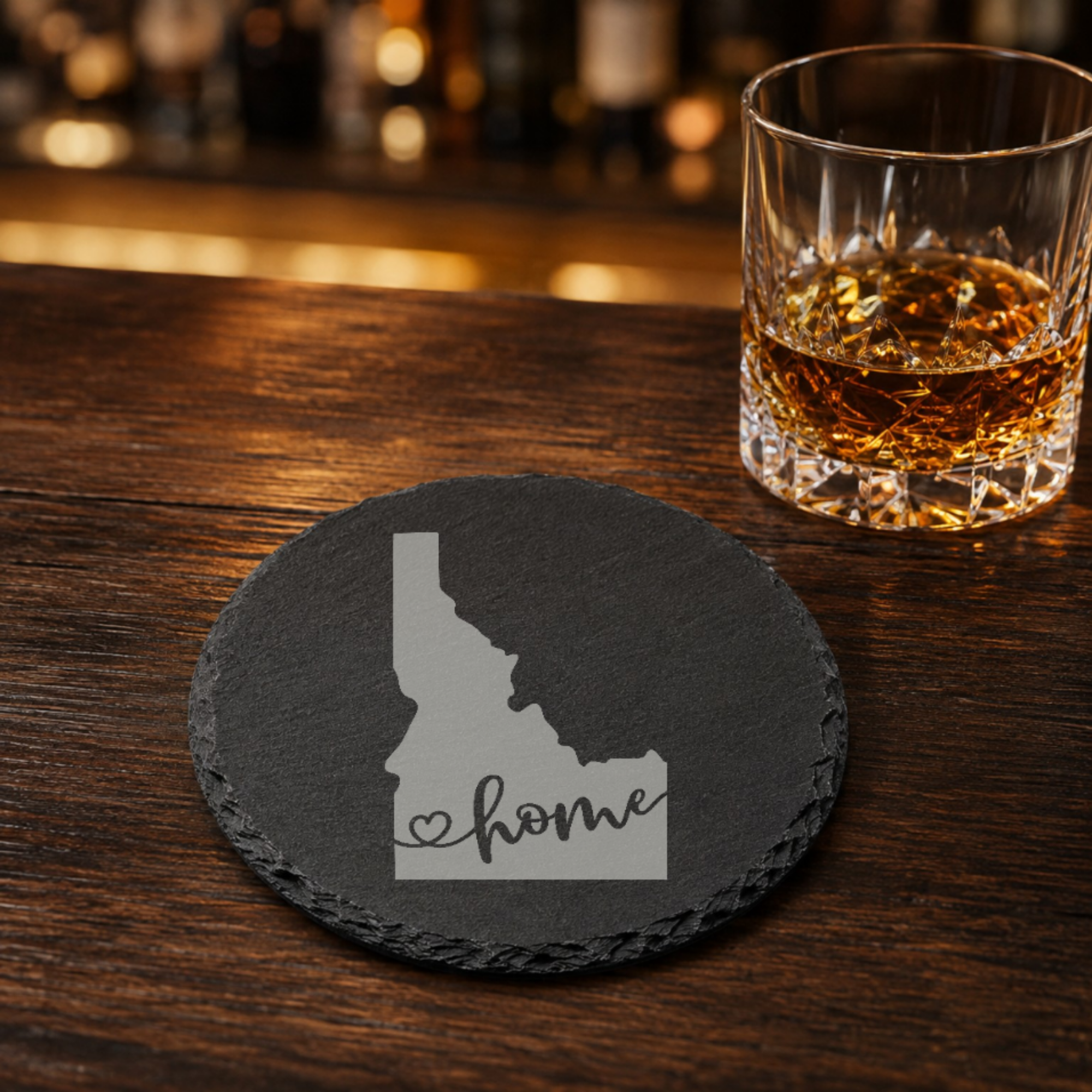Idaho Slate Coasters 4x4 Laser Engraved Stone Drink Coasters Idaho Home Decor Gem State Established 1890 Gift — Dandelion Design Co. — SlateStudioMedia:gallery:25 — 0070-ISGN_idaho_slate_coasters_4x4_laser_engraved_stone_drink_coasters_idaho_home_decor_gem_state_established_1890_gift_22_D03_round_whiskey_lifestyle.png