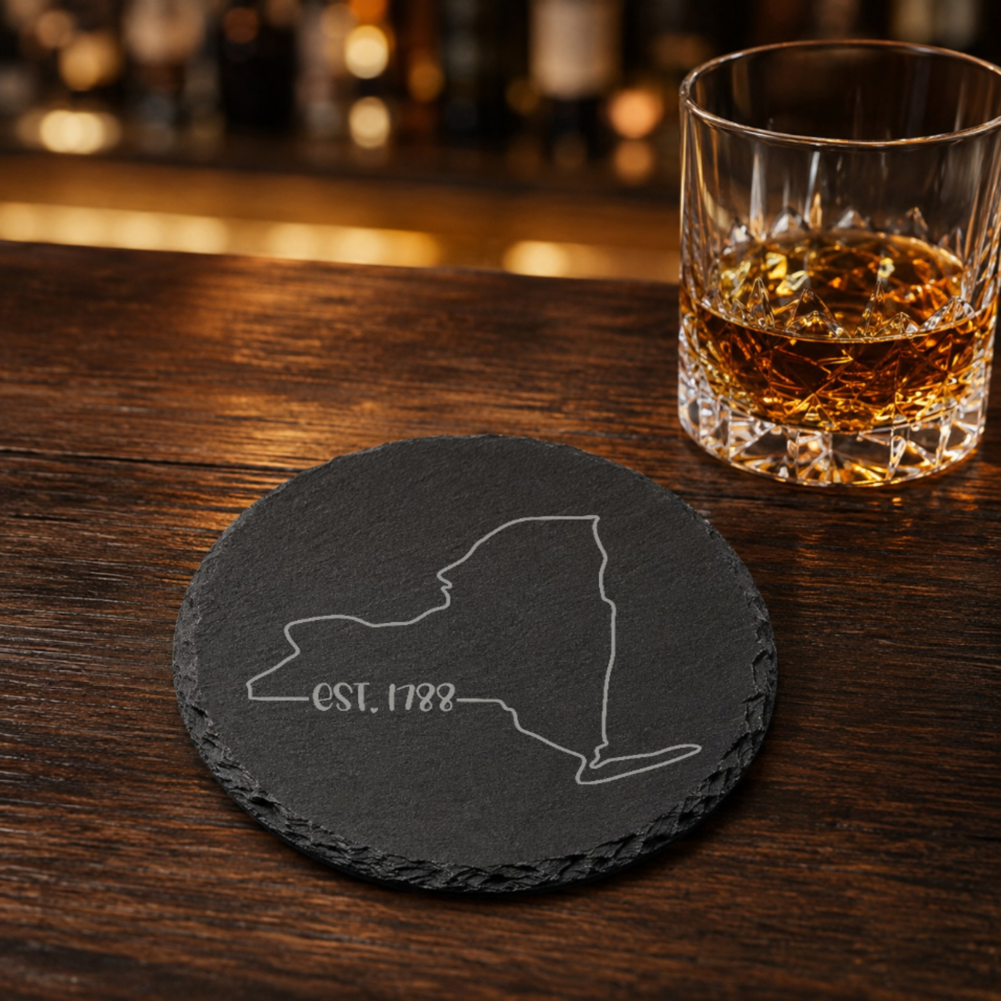 New York Themed Slate Drink Coasters Bulk Order | Corporate Event Gifts | Conference Swag Bags | Retreat Welcome Kits | Business Events — Dandelion Design Co. — SlateStudioMedia:gallery:19 — 0083-NYGN_new_york_themed_slate_drink_coasters_bulk_order_corporate_event_gifts_conference_swag_bags_retreat_welcome_kits_business_events_16_D02_round_whiskey_lifestyle.png