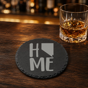 Nevada Themed Slate Drink Coasters Bulk Order | Las Vegas Corporate Event Gifts | Conference Swag Bags | Retreat Welcome Kits | Business — Dandelion Design Co. — SlateStudioMedia:gallery:17 — 0084-NTGN_nevada_themed_slate_drink_coasters_bulk_order_las_vegas_corporate_event_gifts_conference_swag_bags_retreat_welcome_kits_business_08_round_whiskey_lifestyle.png