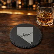 Nevada Themed Slate Drink Coasters Bulk Order | Las Vegas Corporate Event Gifts | Conference Swag Bags | Retreat Welcome Kits | Business — Dandelion Design Co. — SlateStudioMedia:gallery:19 — 0084-NTGN_nevada_themed_slate_drink_coasters_bulk_order_las_vegas_corporate_event_gifts_conference_swag_bags_retreat_welcome_kits_business_16_D02_round_whiskey_lifestyle.png