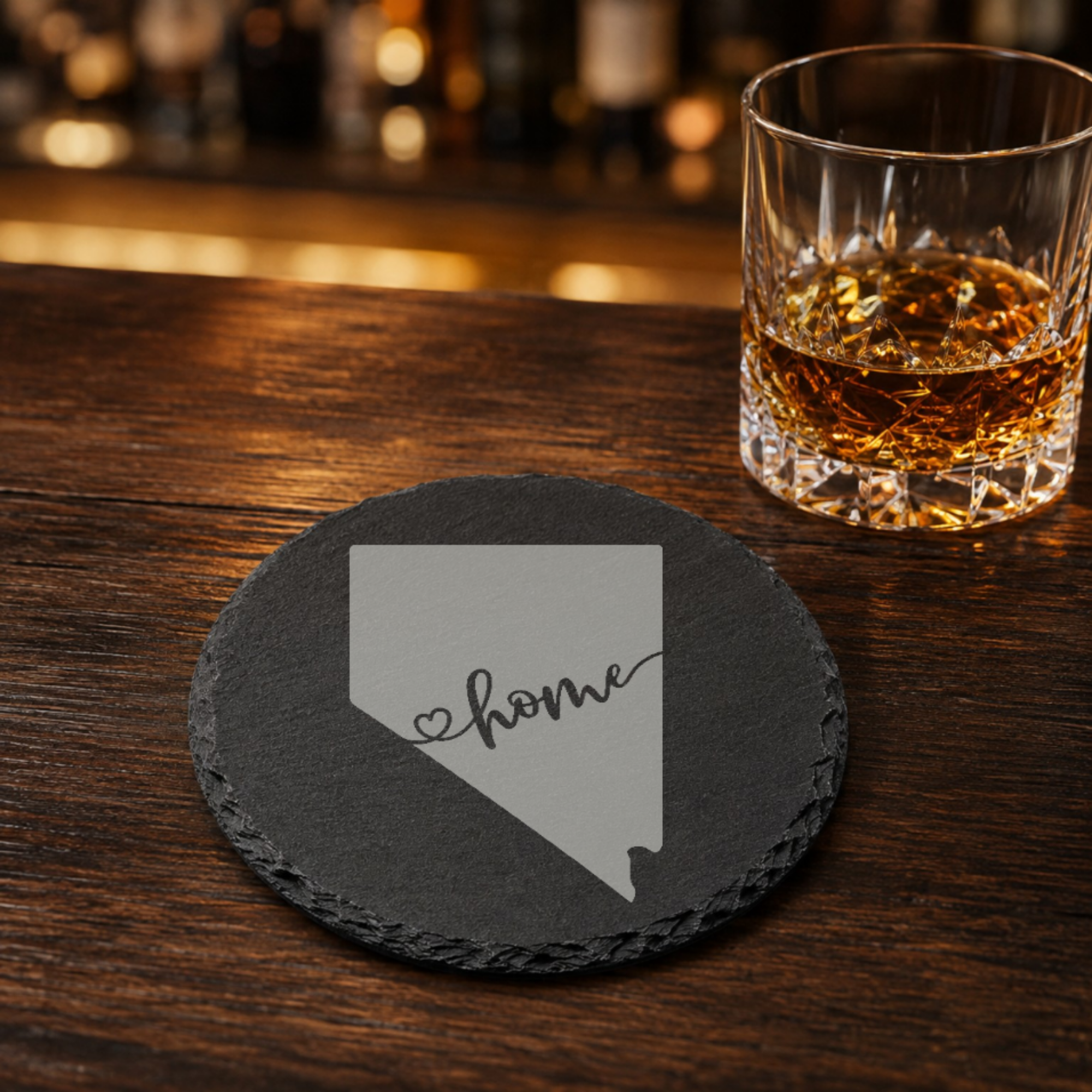 Nevada Themed Slate Drink Coasters Bulk Order | Las Vegas Corporate Event Gifts | Conference Swag Bags | Retreat Welcome Kits | Business — Dandelion Design Co. — SlateStudioMedia:gallery:19 — 0084-NTGN_nevada_themed_slate_drink_coasters_bulk_order_las_vegas_corporate_event_gifts_conference_swag_bags_retreat_welcome_kits_business_16_D02_round_whiskey_lifestyle.png