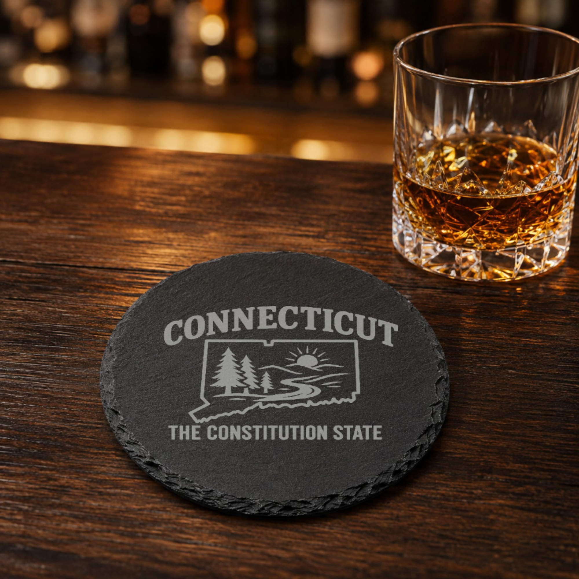 Connecticut Slate Coasters 4x4 Laser Engraved Stone Drink Coasters Connecticut Home Décor Constitution State Established 1788 Gift — Dandelion Design Co. — SlateStudioMedia:gallery:27 — 0088-CSGN_connecticut_slate_coasters_4x4_laser_engraved_stone_drink_coasters_connecticut_home_d_cor_constitution_state_established_1788_gift_28_D04_round_whiskey_lifestyle.png