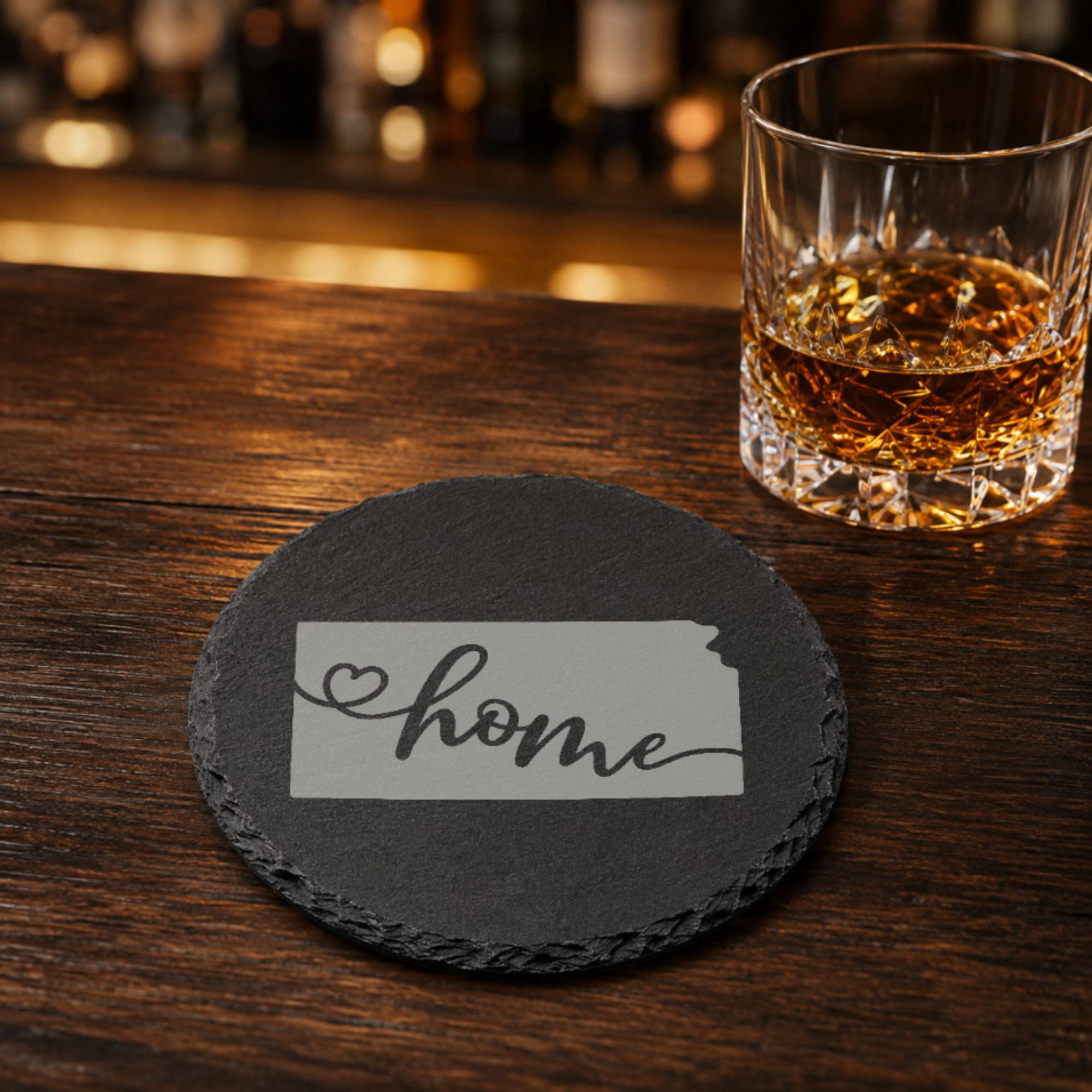 Kansas Slate Coasters 4x4 Laser Engraved Stone Drink Coasters Kansas Home Décor Sunflower State Established 1861 Gift — Dandelion Design Co. — SlateStudioMedia:gallery:19 — 0094-KSGN_kansas_slate_coasters_4x4_laser_engraved_stone_drink_coasters_kansas_home_d_cor_sunflower_state_established_1861_gift_16_D02_round_whiskey_lifestyle.png