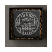 Idaho Area Code Slate Coasters | 208 & 986 Rustic Idaho Gifts | Engraved Mountain Cabin Stone Coasters — Dandelion Design Co. — SlateStudioMedia:gallery:6 — 0098-IAGN_idaho_area_code_slate_coasters_208_986_rustic_idaho_gifts_engraved_mountain_cabin_stone_coasters_05_square_gift_box.png