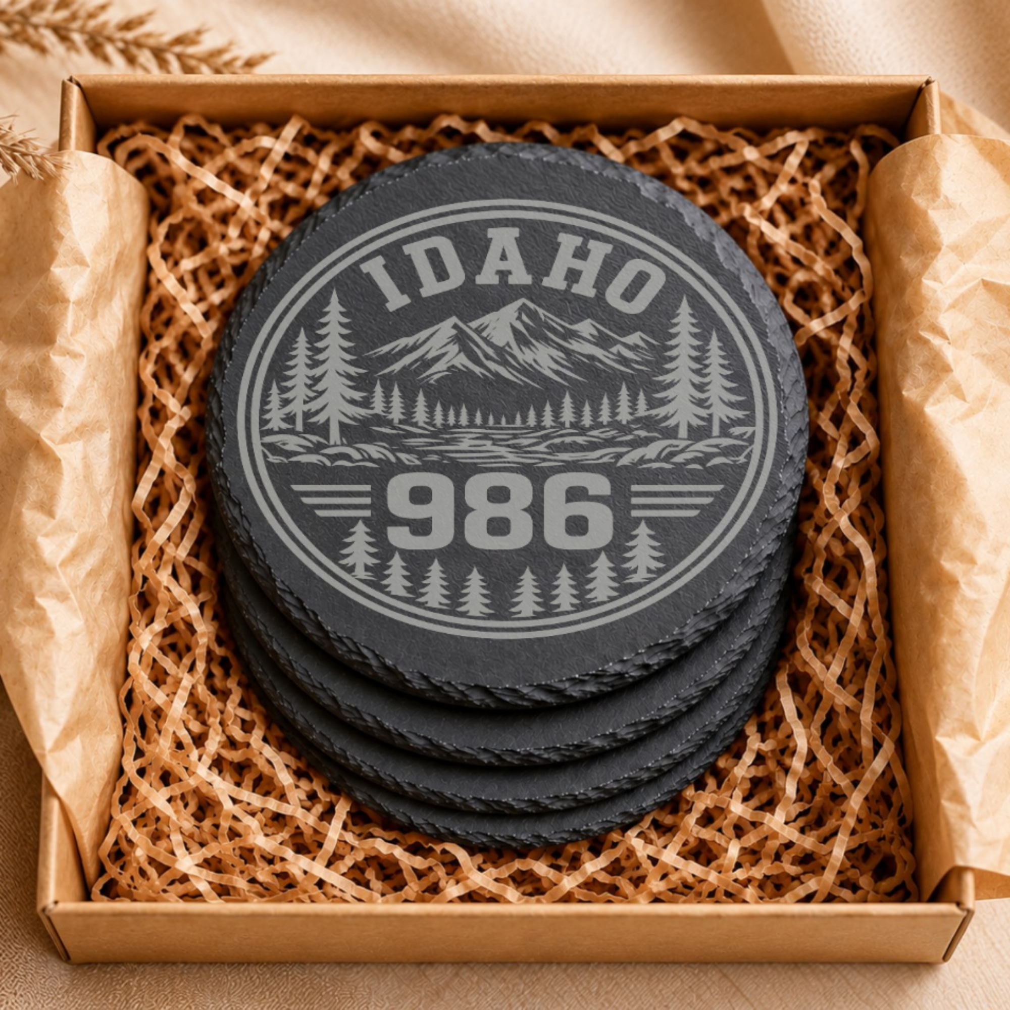 Idaho Area Code Slate Coasters | 208 & 986 Rustic Idaho Gifts | Engraved Mountain Cabin Stone Coasters — Dandelion Design Co. — SlateStudioMedia:gallery:7 — 0098-IAGN_idaho_area_code_slate_coasters_208_986_rustic_idaho_gifts_engraved_mountain_cabin_stone_coasters_06_round_gift_box.png
