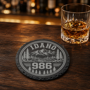 Idaho Area Code Slate Coasters | 208 & 986 Rustic Idaho Gifts | Engraved Mountain Cabin Stone Coasters — Dandelion Design Co. — SlateStudioMedia:gallery:13 — 0098-IAGN_idaho_area_code_slate_coasters_208_986_rustic_idaho_gifts_engraved_mountain_cabin_stone_coasters_08_round_whiskey_lifestyle.png