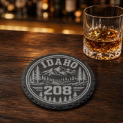 Idaho Area Code Slate Coasters | 208 & 986 Rustic Idaho Gifts | Engraved Mountain Cabin Stone Coasters — Dandelion Design Co. — SlateStudioMedia:gallery:15 — 0098-IAGN_idaho_area_code_slate_coasters_208_986_rustic_idaho_gifts_engraved_mountain_cabin_stone_coasters_16_D02_round_whiskey_lifestyle.png