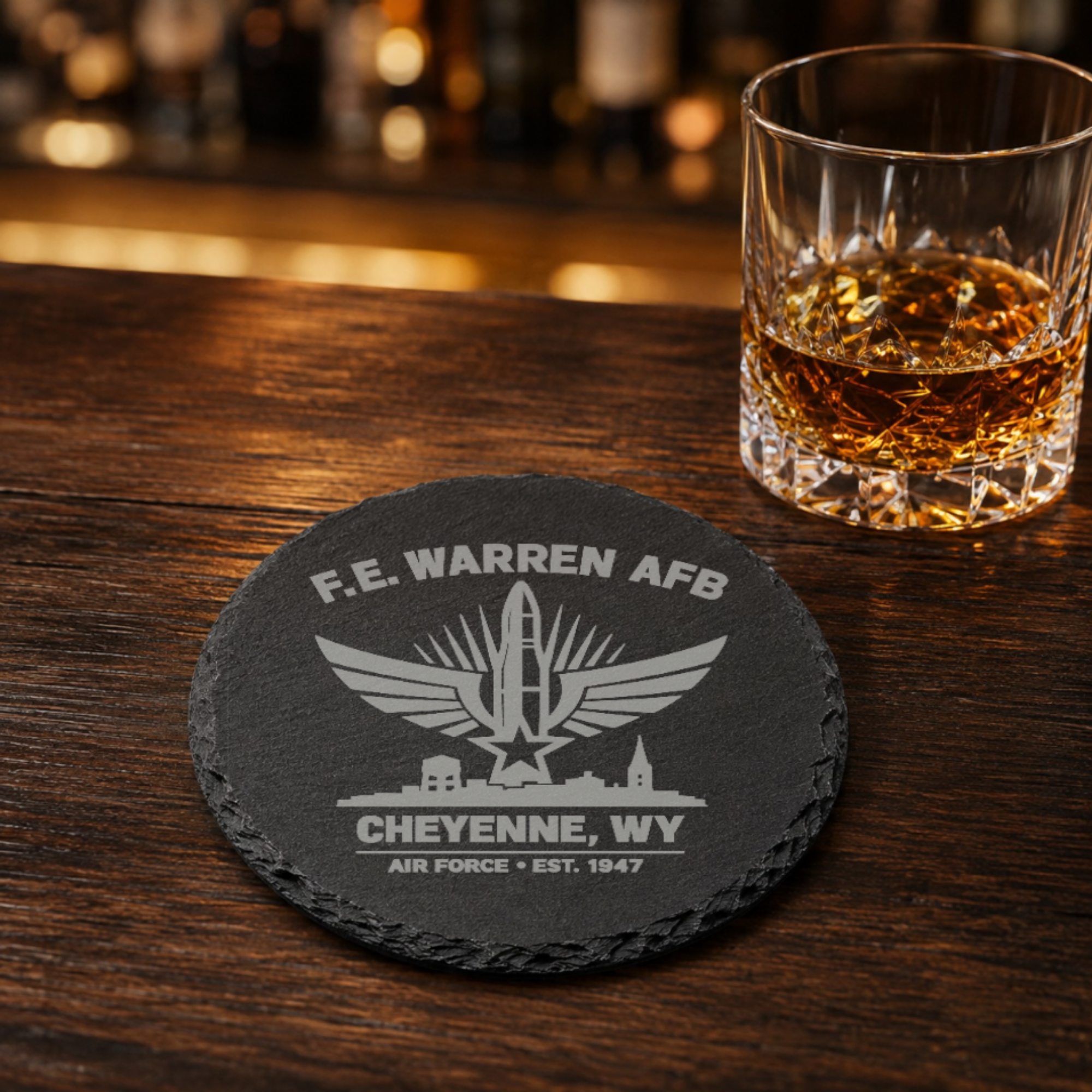 Cheyenne Wyoming Air Force Coaster | F.E. Warren AFB Gift | Military Slate Coaster | Veteran Gift | USAF Inspired Decor | Missile Engraved — Dandelion Design Co. — SlateStudioMedia:gallery:9 — 0103-CWGN_cheyenne_wyoming_air_force_coaster_f_e_warren_afb_gift_military_slate_coaster_veteran_gift_usaf_inspired_decor_missile_engraved_08_round_whiskey_lifestyle.png