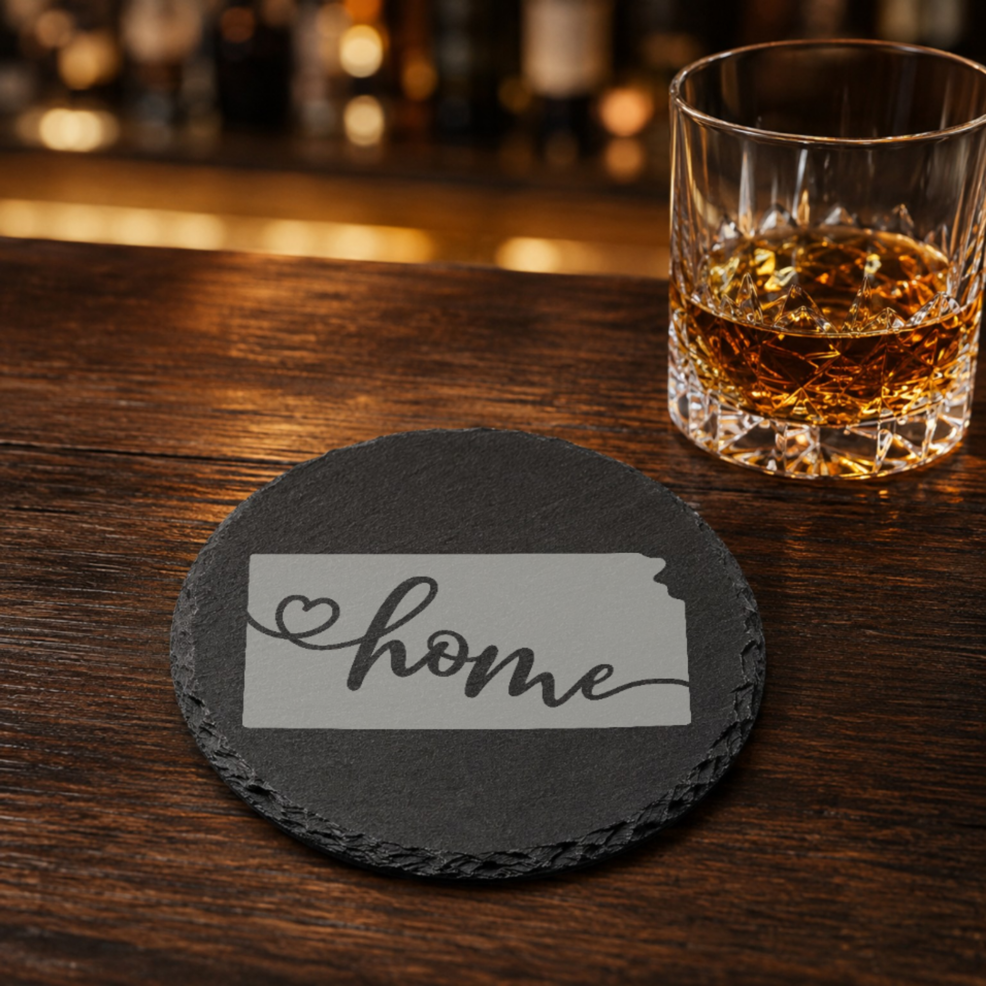 Kansas Slate Coasters 4x4 Laser Engraved Stone Drink Coasters Kansas Home Décor Sunflower State Established 1861 Gift — Dandelion Design Co. — SlateStudioMedia:gallery:19 — 0103-KSGN_kansas_slate_coasters_4x4_laser_engraved_stone_drink_coasters_kansas_home_d_cor_sunflower_state_established_1861_gift_16_D02_round_whiskey_lifestyle.png