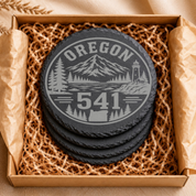 Oregon Area Code Slate Coasters | 503 971 541 458 Oregon Gift | Engraved Rustic Stone Coaster | Pacific Northwest Cabin Decor — Dandelion Design Co. — SlateStudioMedia:gallery:11 — 0104-OAGN_oregon_area_code_slate_coasters_503_971_541_458_oregon_gift_engraved_rustic_stone_coaster_pacific_northwest_cabin_decor_06_round_gift_box.png