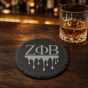 Zeta Phi Beta Sorority Slate Coasters • ZΦB Gift • Founder’s Day Gift • Devastating Diva Gift • Zeta Home Decor • Greek Life Sorority Gift — Dandelion Design Co. — SlateStudioMedia:gallery:27 — 0115-ZPGN_zeta_phi_beta_sorority_slate_coasters_z_b_gift_founder_s_day_gift_devastating_diva_gift_zeta_home_decor_greek_life_sorority_gift_16_D02_round_whiskey_lifestyle.png
