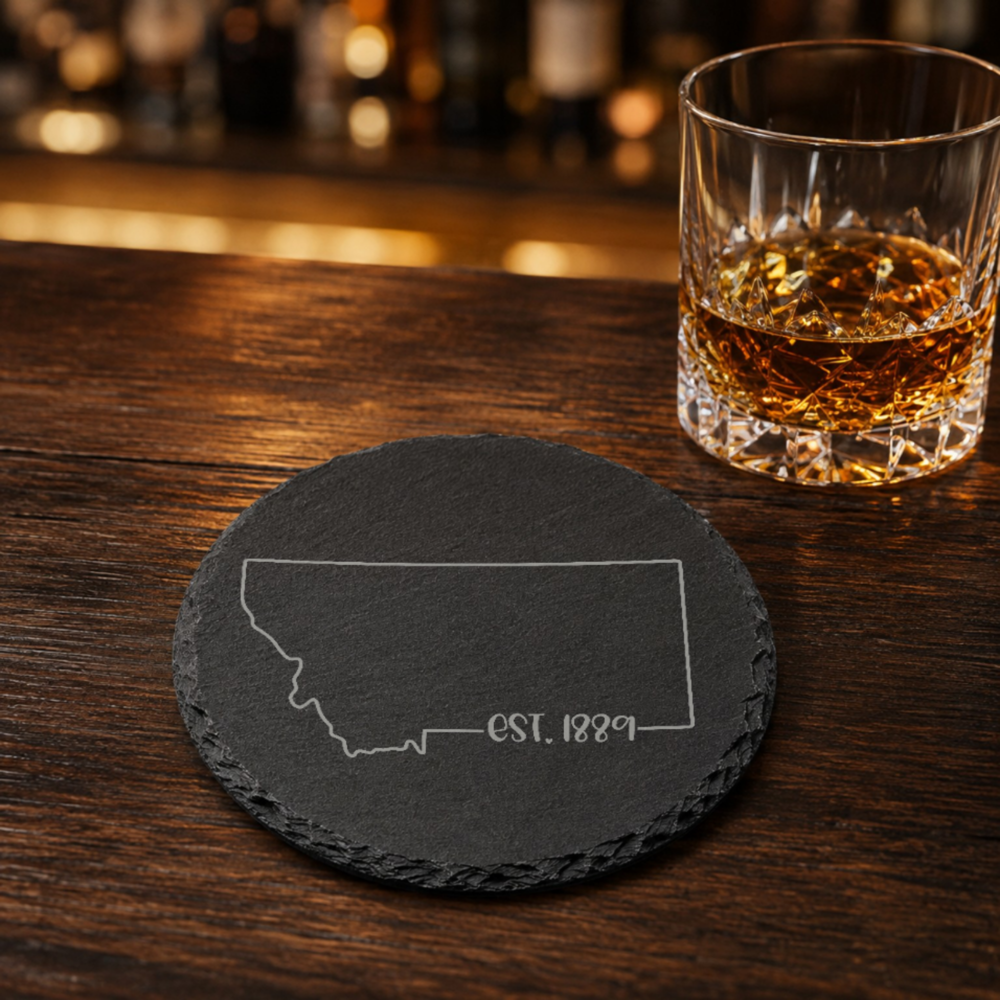 Montana Slate Coasters 4x4 Laser Engraved Stone Drink Coasters Montana Home Décor Treasure State Established 1889 Gift — Dandelion Design Co. — SlateStudioMedia:gallery:25 — 0117-MSGN_montana_slate_coasters_4x4_laser_engraved_stone_drink_coasters_montana_home_d_cor_treasure_state_established_1889_gift_22_D03_round_whiskey_lifestyle.png