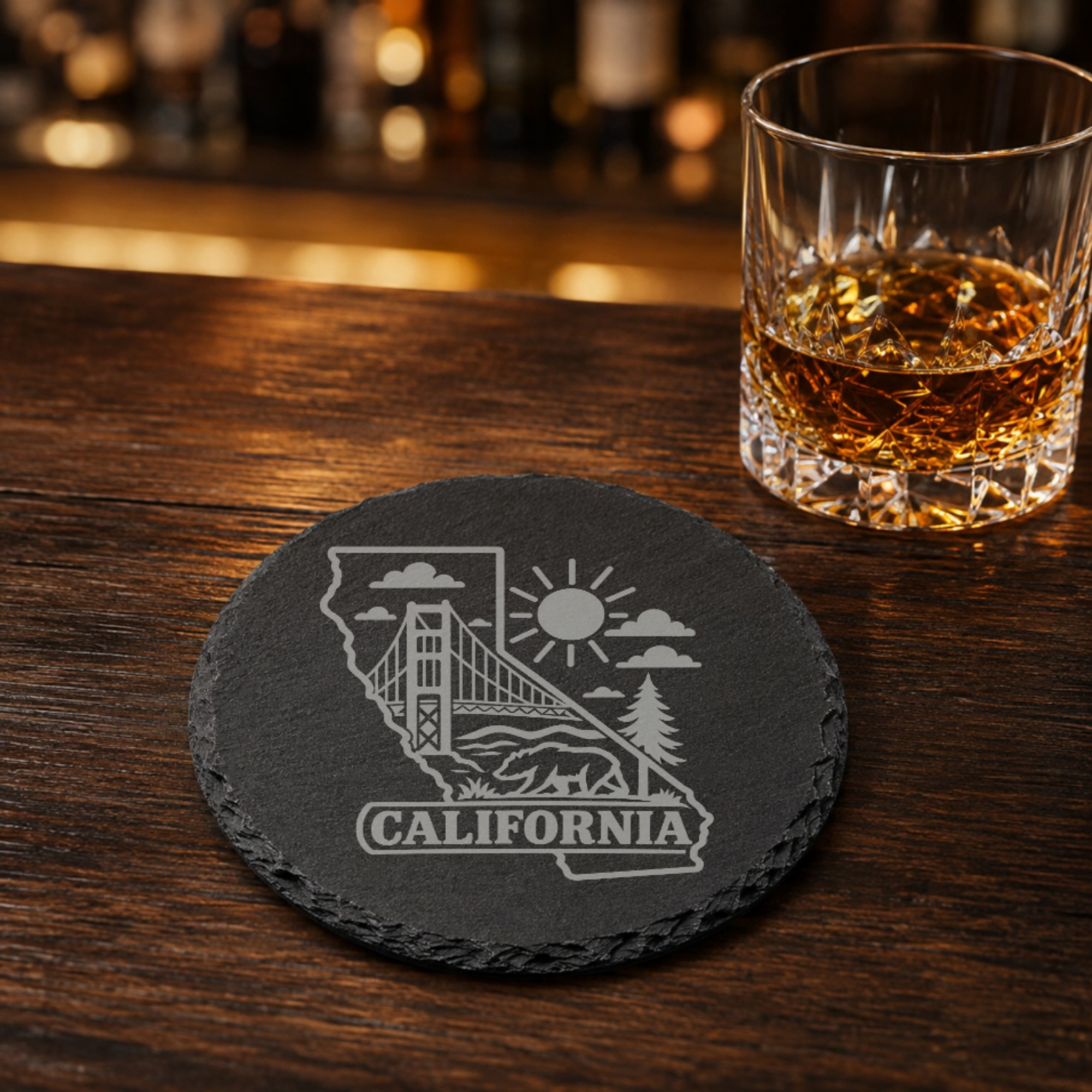 California Slate Coaster - Laser Etched State Design with Golden Gate Bridge, Bear & Sun - Handcrafted Home Decor Gift — Dandelion Design Co. — SlateStudioMedia:gallery:21 — 0119-CSGN_california_slate_coaster_laser_etched_state_design_with_golden_gate_bridge_bear_sun_handcrafted_home_decor_gift_08_round_whiskey_lifestyle.png